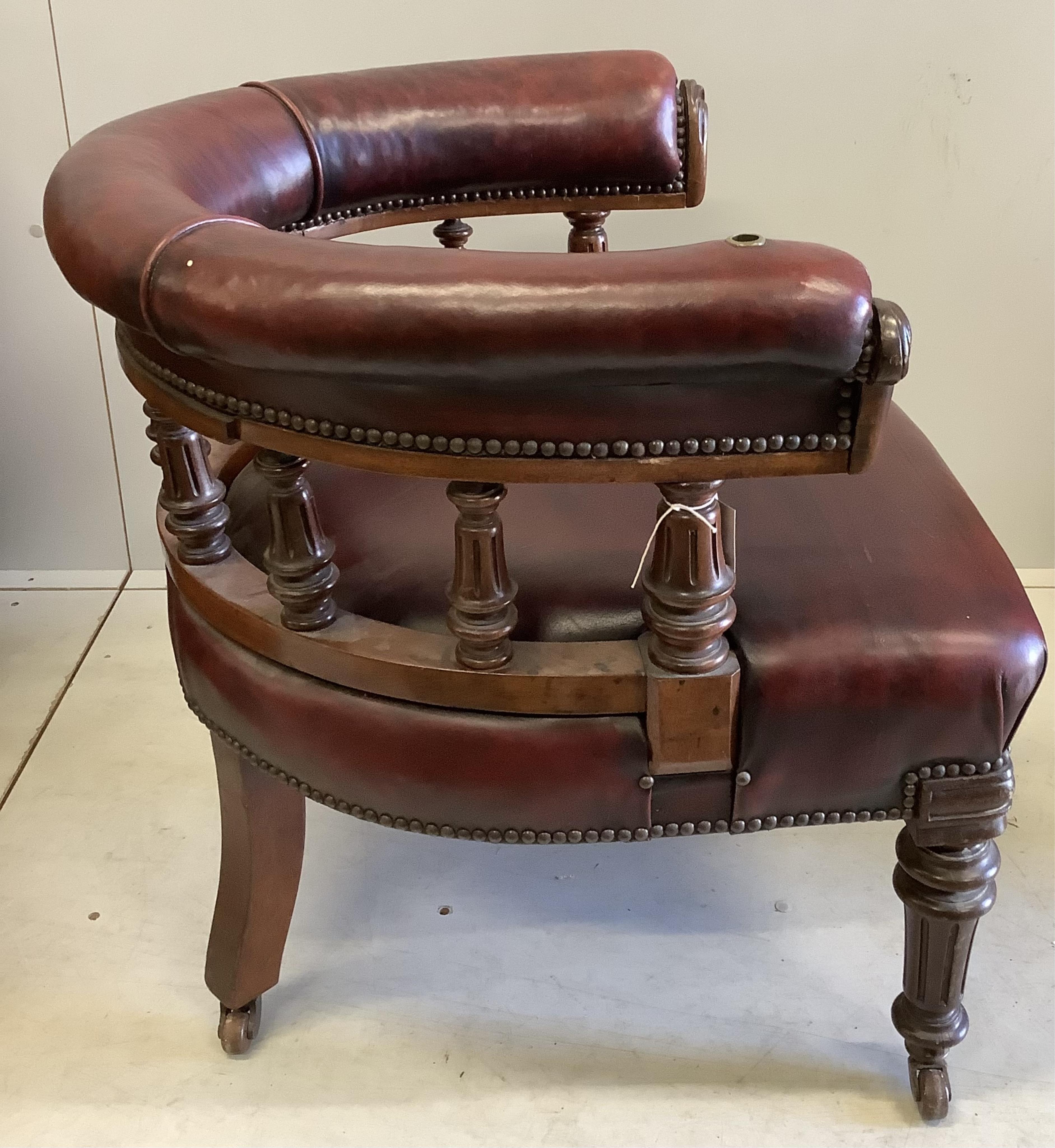 A Victorian walnut burgundy leather club chair, width 75cm, depth 64cm, height 70cm. Condition - good, although lacks reading stand
